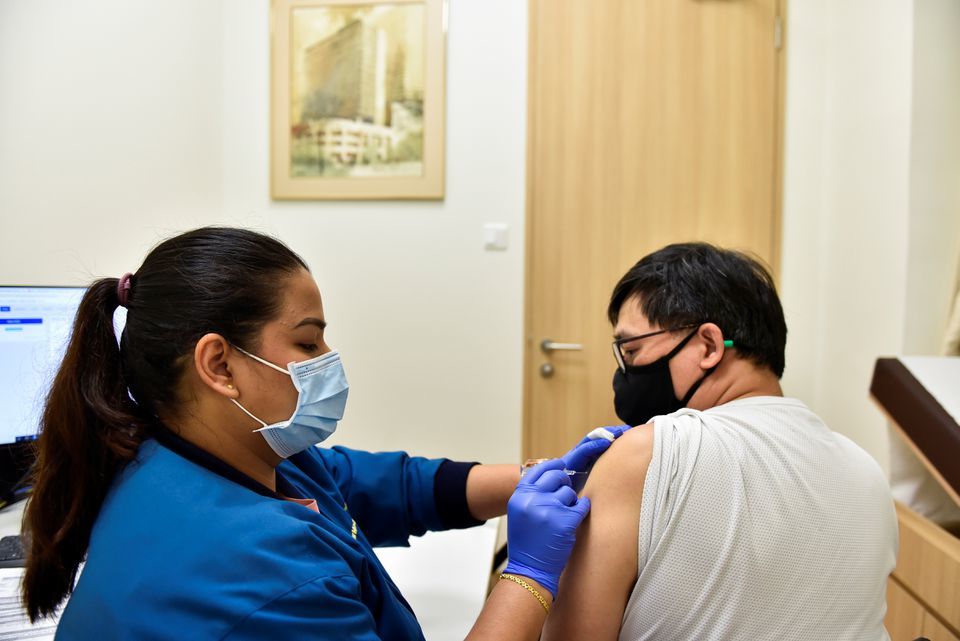 A nurse at StarMed Specialist Centre, administers the Sinovac vaccine, Singapore, July 13. &mdash; Reuters