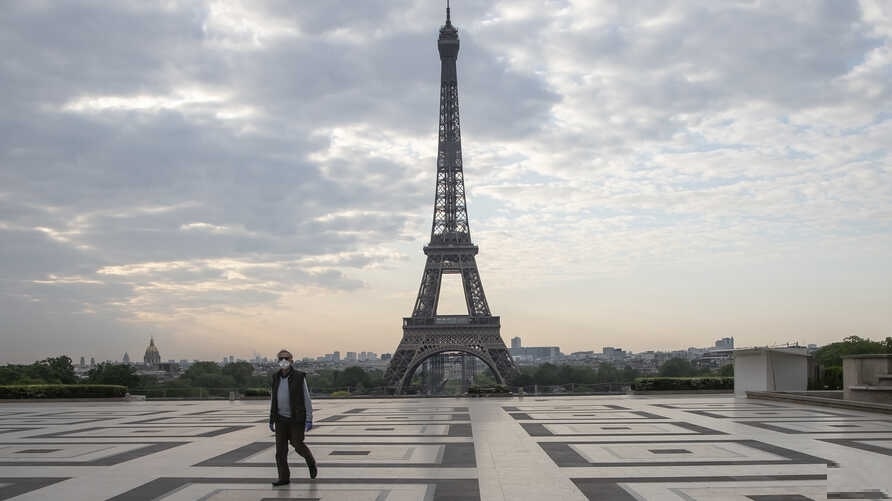 A man wears a mask to protect against the spread of the coronavirus as he walks along the Trocadero square close to the Eiffel Tower in Paris, April 24, 2020. — AP/File.