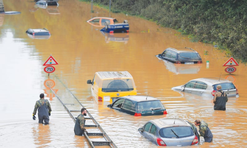 Members of German armed forces search for flood victims in submerged vehicles following heavy rainfall in Erftstadt-Blessem on Saturday. — Reuters