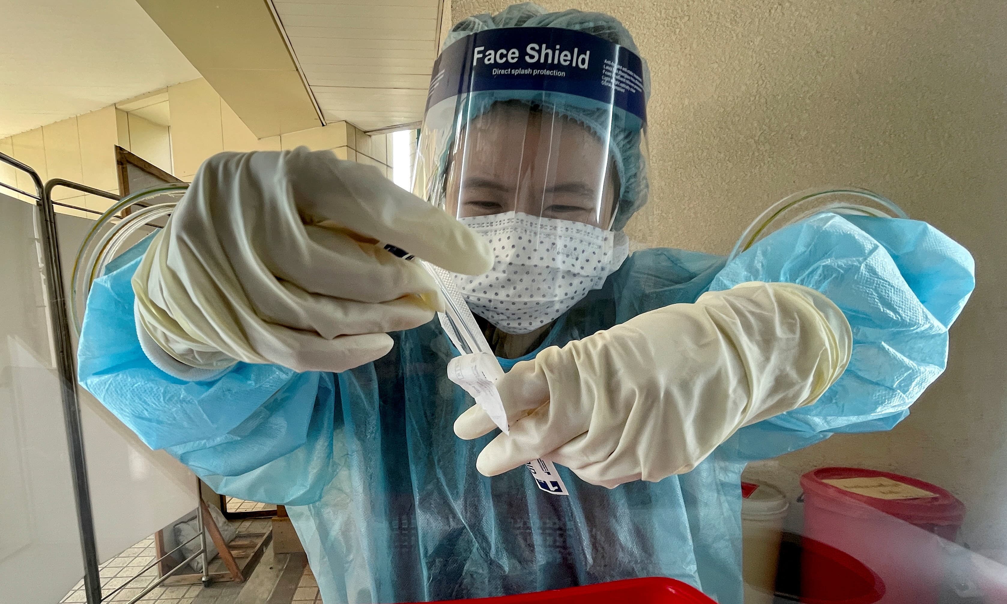 A nurse prepares a coronavirus test in Bangkok, Thailand. — Reuters
