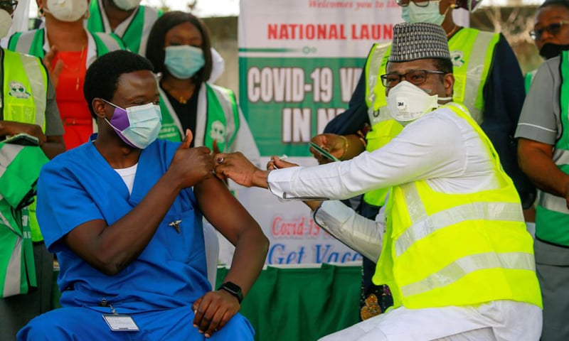 Dr Ngong Cyprian receives his first dose of the Oxford/AstraZeneca vaccine from Dr Faisal Shuaib, Executive Director and Chief Executive Officer of the National Primary Health Care Development Agency, at National hospital in Abuja, Nigeria. — Reuters/File