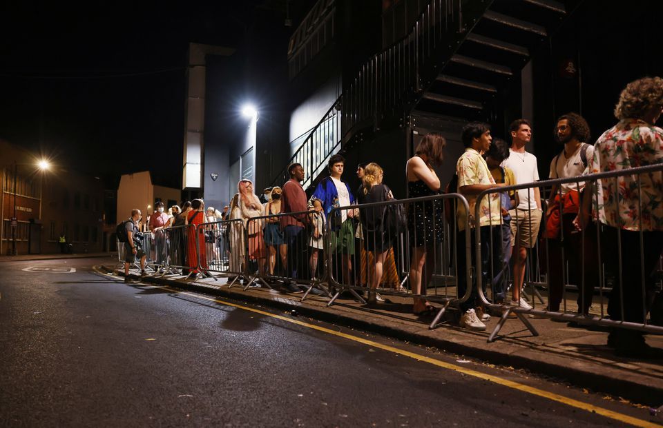 People arrive for the "00:01" event organised by Egyptian Elbows at Oval Space nightclub, as England lifted most coronavirus restrictions at midnight, in London, Britain, July 19. — Reuters