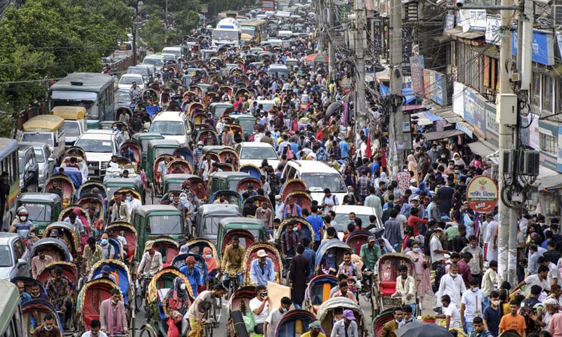 People crowd a market area ahead of Eidul Azha in Dhaka, Bangladesh. &mdash; AP