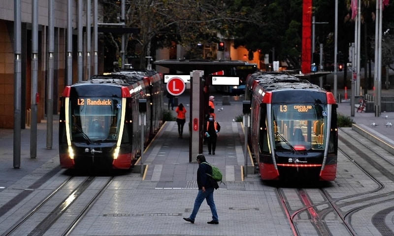 A man wearing a face mask walks towards tram station at Circular Quay in Sydney on July 19 amid a lockdown in Melbourne and Sydney as Australia seeks to contain a surge in coronavirus cases. — AFP