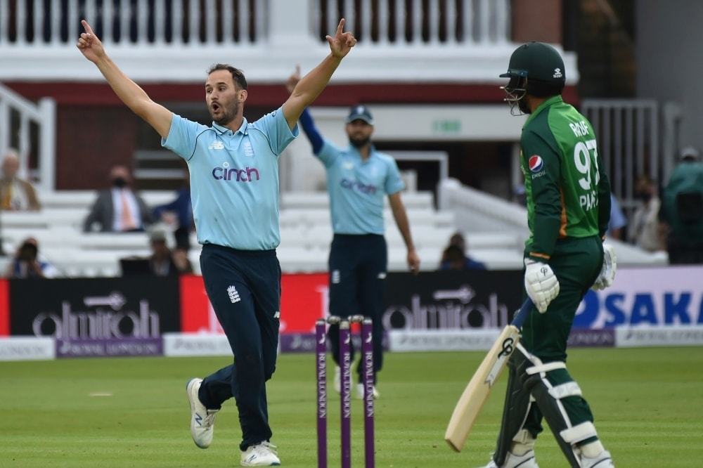 England's Lewis Gregory, left, celebrates the dismissal of Haris Rauf, right, during an ODI match. &mdash; AP/File