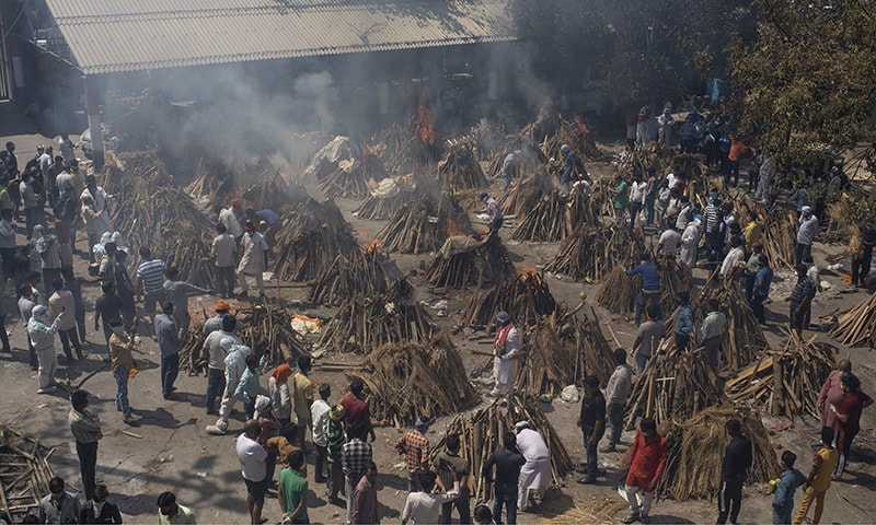 Multiple funeral pyres of those who died of Covid-19 burn at a ground that has been converted into a crematorium for the mass cremation of coronavirus victims, in New Delhi, India. — AP/File