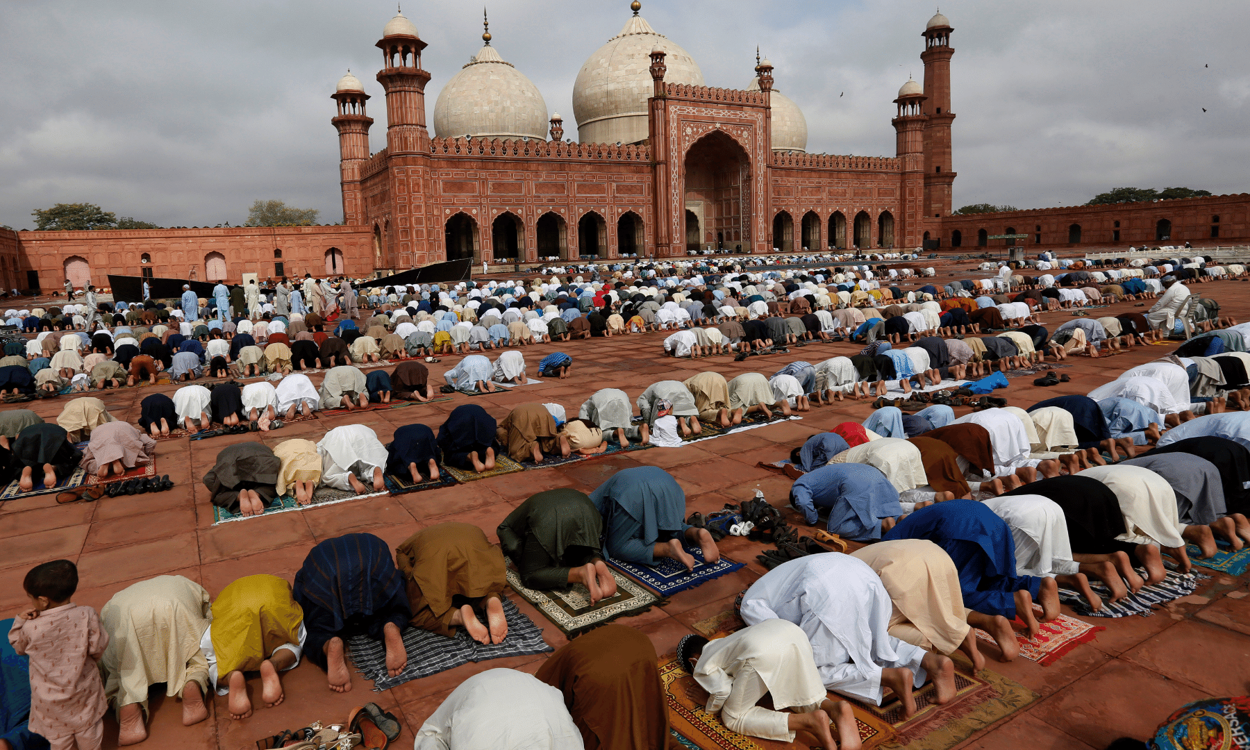 People attend Eidul Azha prayers at the historical Badshahi mosque in Lahore. — AP