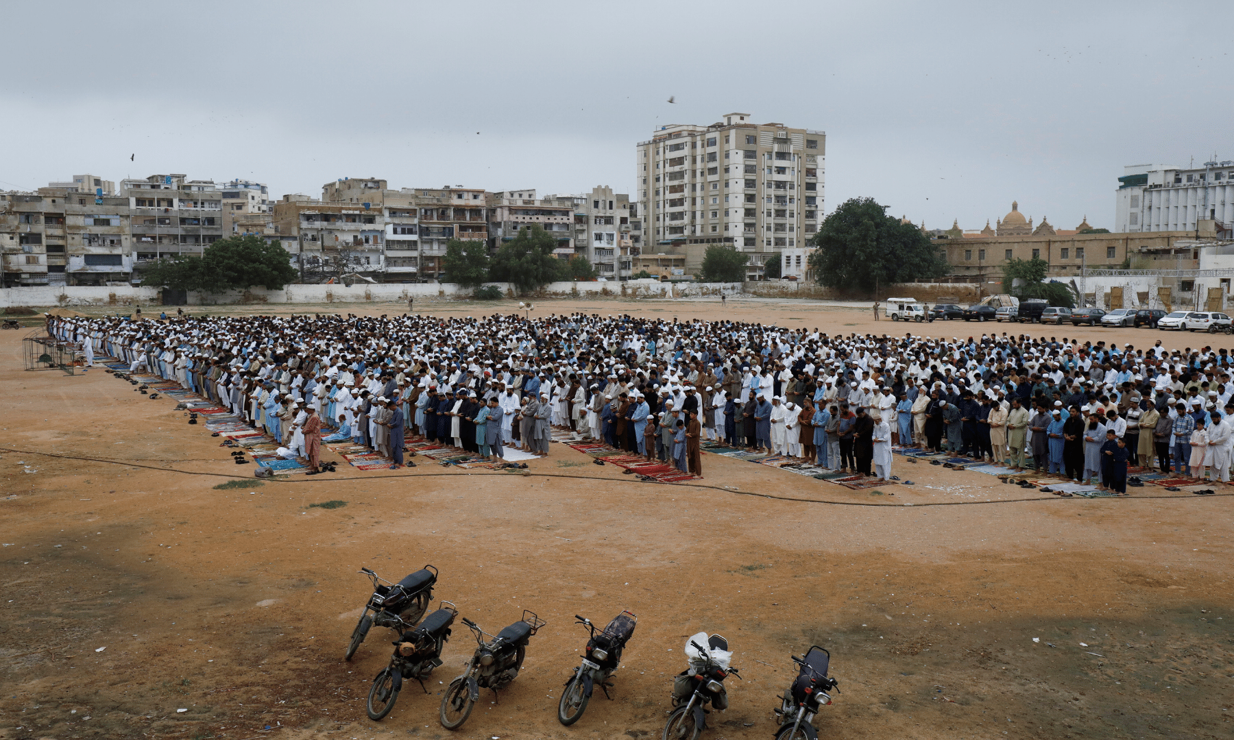 People attend Eidul Azha prayers at a playground, as the outbreak of the coronavirus continues, in Karachi. — Reuters