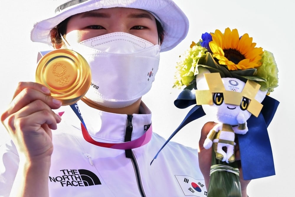 Gold medallist Kang Chae Young of South Korea celebrates with Tokyo 2020 Olympic mascot Miraitowa. — Reuters