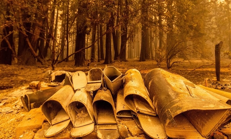 Scorched mailboxes lie on the ground after the Dixie Fire passed through the Indian Falls community of Plumas County on July 25. — AP