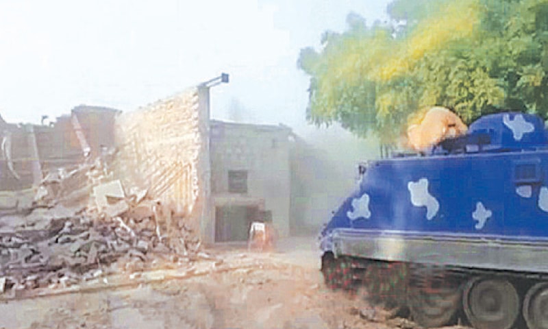 AN armoured personnel carrier advancing into the battlefield cleared by bulldozers.—Dawn