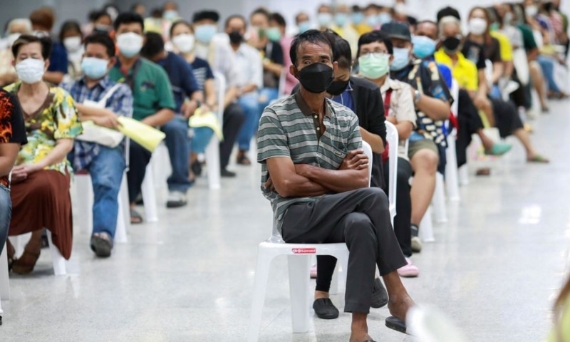 People queue at the Central Vaccination Centre as Thailand begins offering first doses of the AstraZeneca vaccine to at-risk groups in Bangkok, Thailand, July 26. — Reuters