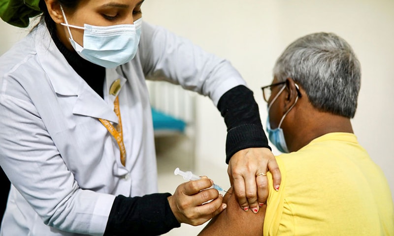 A nurse injects Oxford-AstraZeneca's Covishield vaccine to an elderly man at the Dhaka Medical College vaccination centre in Dhaka, Bangladesh in February, 2021. —Reuters/File