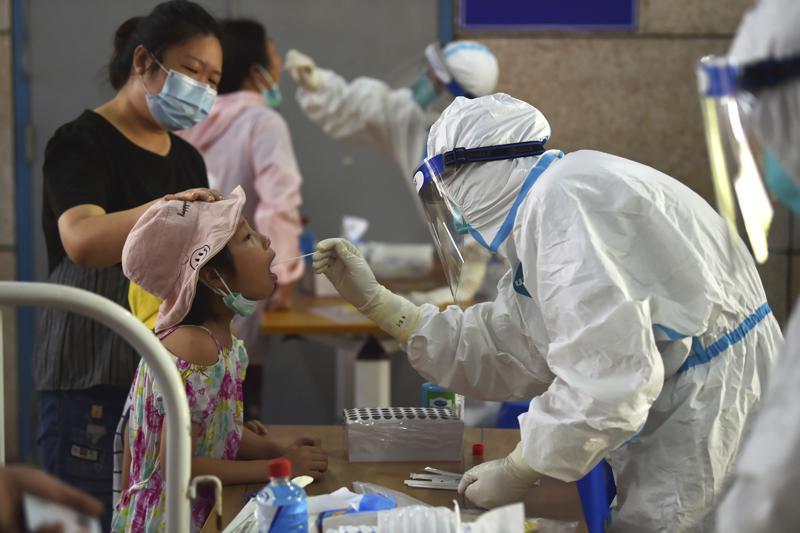 A nurse takes swab samples in the new rounds of Covid-19 testing in Nanjing in eastern China's Jiangsu province, Aug 2. — AP