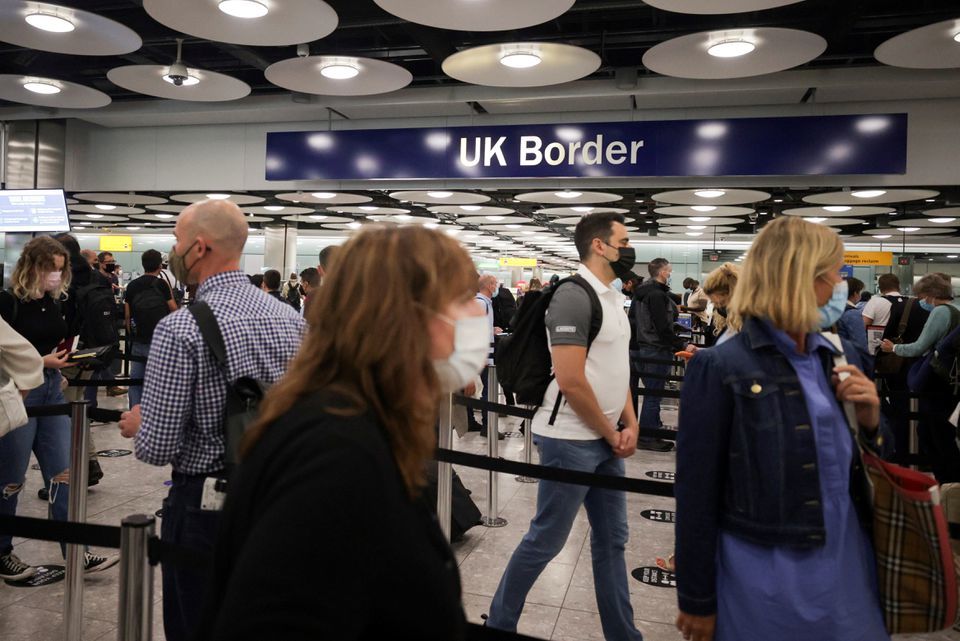 Arriving passengers queue at UK Border Control at Terminal 5 at Heathrow Airport in London, Britain, June 29. — Reuters