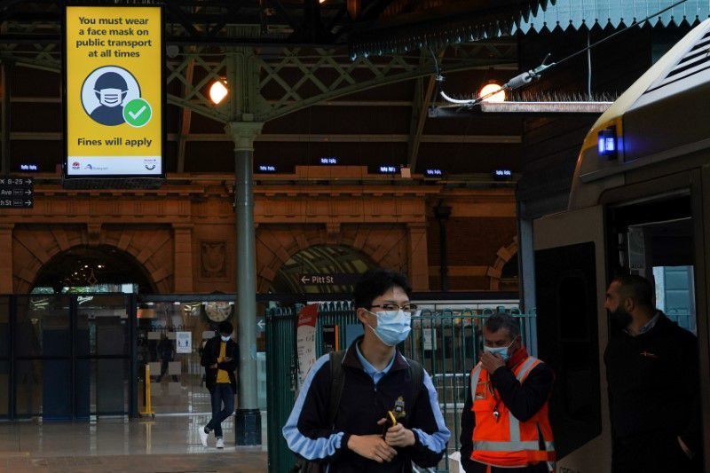 A sign at Central Station notes the implementation of new public health regulations from the state of New South Wales, as the city grapples with an outbreak of the coronavirus in Sydney, Australia, June 23. &mdash; Reuters