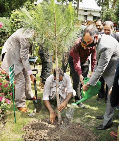 Railways Minister Azam Khan Swati plants a sapling at the Railways Hospital in Dhoke Hassu in Rawalpindi on Monday. &mdash; APP