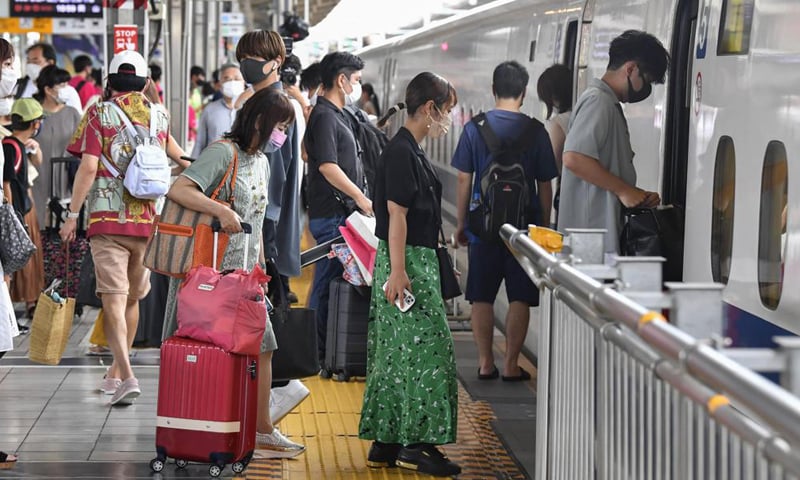 In this file photo, passengers get on Shinkansen bullet train at Shin Osaka Station in Osaka, Japan. — AP/File
