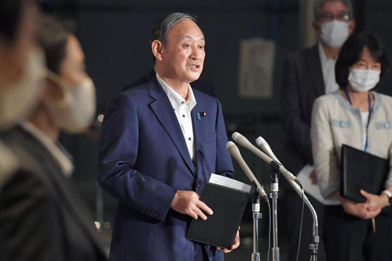 Japanese Prime Minister Yoshihide Suga speaks to reporters about the extension of a state of emergency at his official residence in Tokyo, Japan on Aug 16. — AP