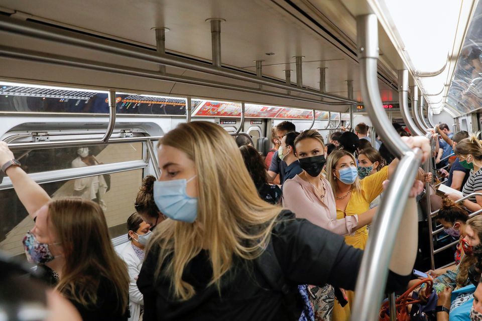 People wear masks while riding on the subway as cases of the infectious coronavirus Delta variant continue to rise in New York City, New York, US, August 2. &mdash; Reuters