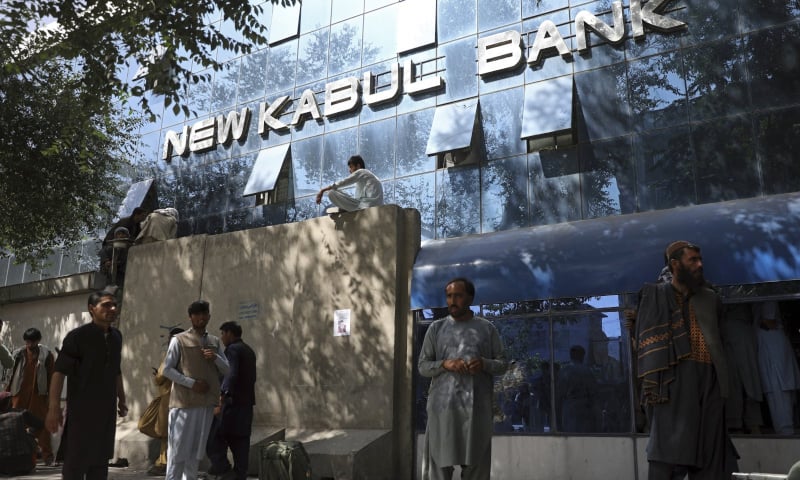 Afghans wait for hours to try to withdraw money, in front of Kabul Bank, in Kabul, Afghanistan on August 15. — AP/File