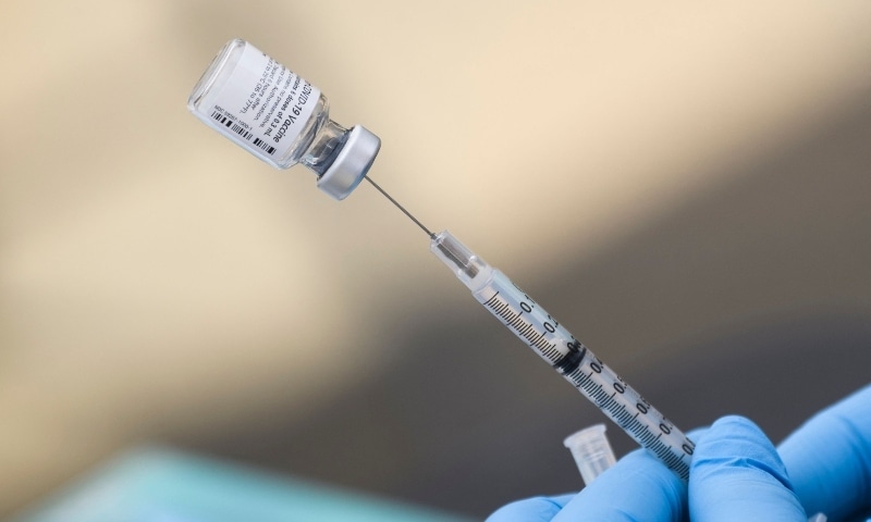 In this file photo a syringe is filled with a first dose of the Pfizer Covid-19 vaccine at a mobile vaccination clinic at the Weingart East Los Angeles YMCA in Los Angeles on August 7. — AFP In this file photo a syringe is filled with a first dose of the Pfizer Covid-19 vaccine at a mobile vaccination clinic at the Weingart East Los Angeles YMCA in Los Angeles on August 7. — AFP