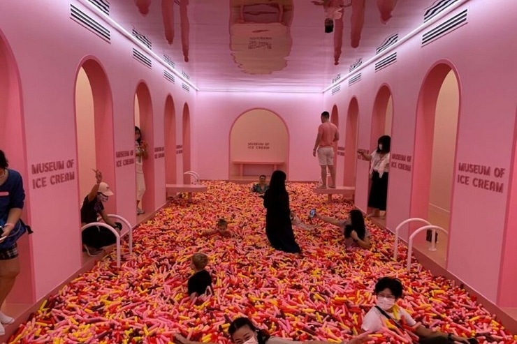 Visitors play in a 'sprinkle pool' at the Museum of Ice Cream in Singapore, August 19, 2021. — Reuters