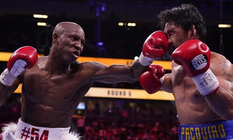 Yordenis Ugas (L) of Cuba, hits Manny Pacquiao, of the Philippines, in a welterweight championship boxing match in Las Vegas, US on Aug 21. &mdash; AP
