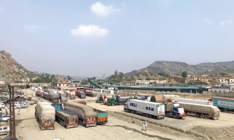 Trucks loaded with trade goods at Torkham border wait for permission to enter Afghanistan. — Dawn