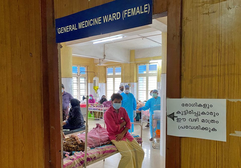 A man looks out from a coronavirus ward in the Government Medical College Hospital in Manjeri, in the Malappuram district of the southern state of Kerala, India on August 18. — Reuters