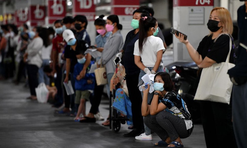 In this file photo, people queue for free Covid-19 rapid antigen tests at a mass testing station in Bangkok, Thailand. — Reuters/File