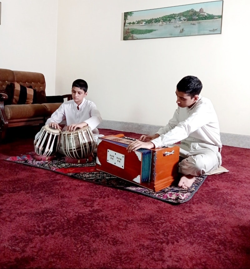 Muneeb (right) on the harmonium and Mubeen (left) on the Tabla