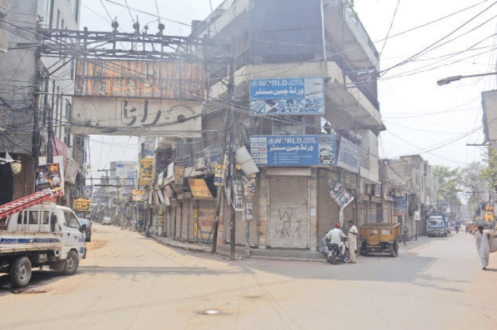 LAHORE: Shops at a market are closed on Saturday during a weekly smart lockdown aimed at controlling Covid-19.—Online