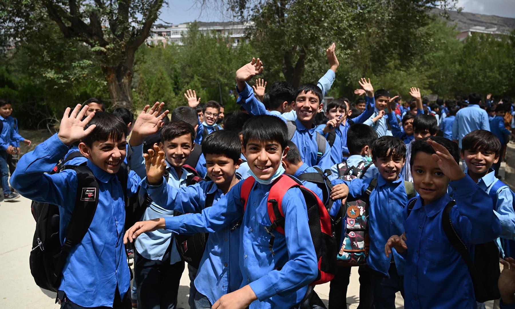 In pictures: Some Afghan students return to schools in Kabul but most ...