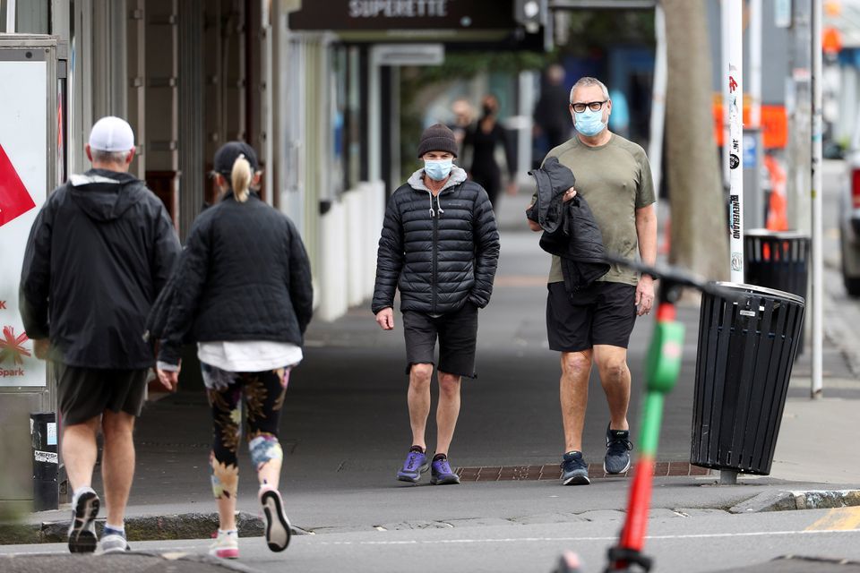 People wear masks as they exercise during a lockdown to curb the spread of a coronavirus outbreak, in Auckland, New Zealand on August 26. — Reuters