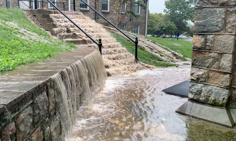 Floodwater gushes down steps during flash floods in Emmitsburg, Maryland in this still image taken from video obtained from social media. &mdash; Reuters