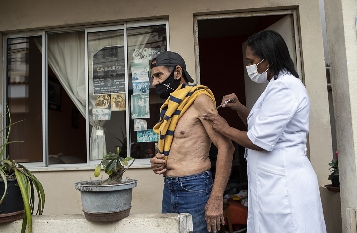 Andre Luiz da Silva, 70, is injected with a dose of the Pfizer Covid-19 vaccine during a third dose campaign for elderly residents in long-term care institutions, at a retreat for elderly artists, in Rio de Janeiro, Brazil on Sept 1. &mdash; AP