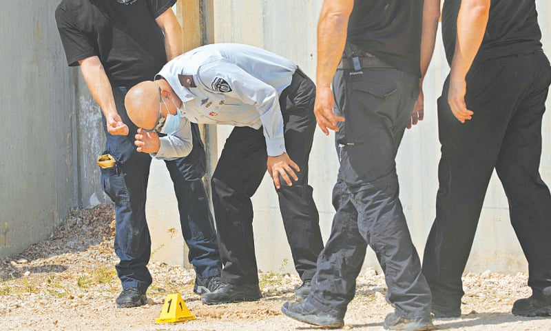 HEAD of Israel Prison Service Arik Yaakov looks at evidence outside the Gilboa Prison in northern Israel on Monday. &mdash;AFP
