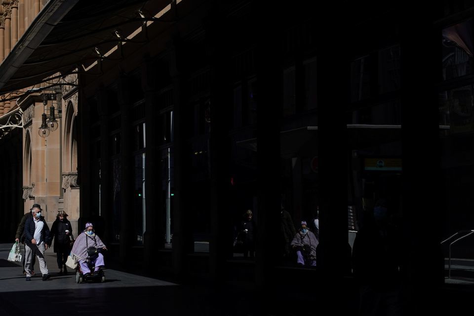 People navigate the city centre during a lockdown to curb the spread of a coronavirus outbreak in Sydney, Australia on September 7. — Reuters