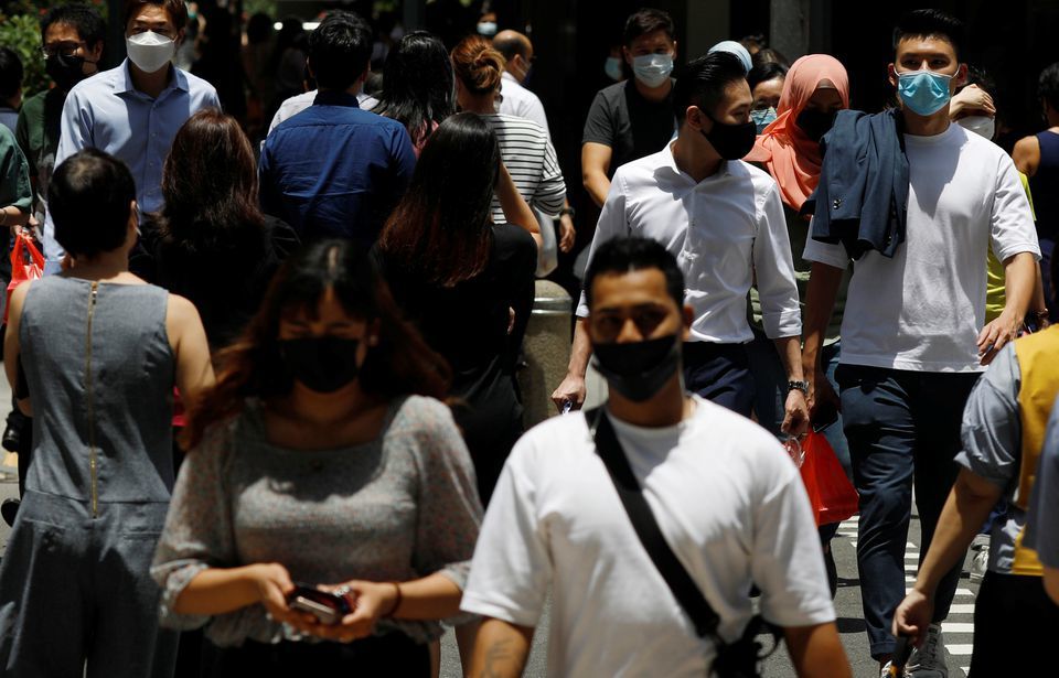 Office workers spend their lunch breaks at the central business district during the coronavirus outbreak in Singapore on September 8. &mdash; Reuters