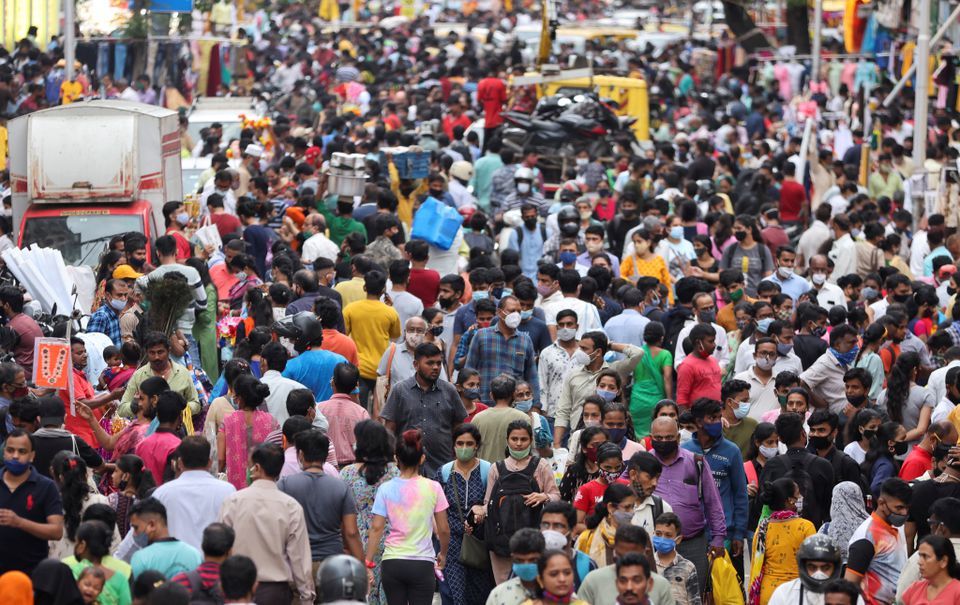 People walk in a crowded market amidst the spread of the coronavirus in Mumbai, India on September 5. — Reuters
