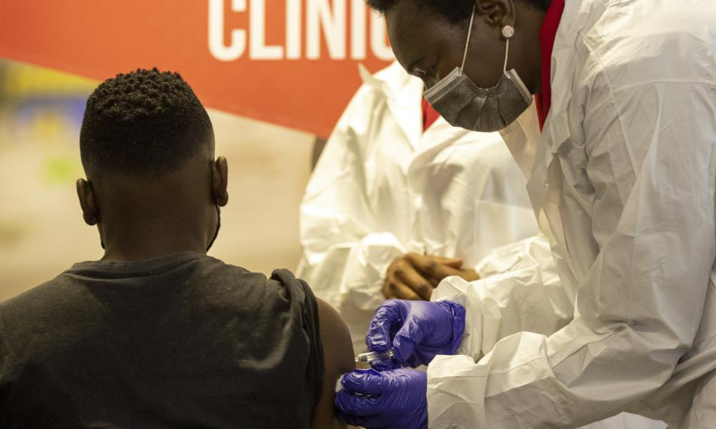 A minor receives Sinovac vaccine jab from a healthcare worker in Pretoria, South Africa, on Friday. &mdash; AP