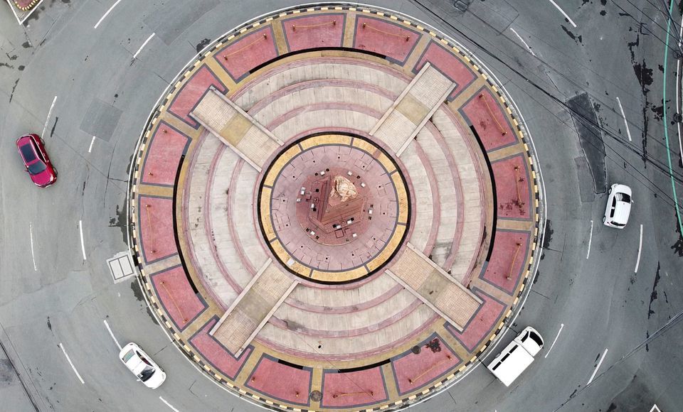 An aerial view shows minimal traffic in a roundabout in Quezon City, during a two-week lockdown following a surge in coronavirus cases, in Metro Manila, Philippines on August 9. &mdash; Reuters