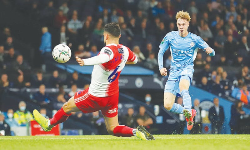MANCHESTER: Manchester City’s Cole Palmer (R) shoots to score during the League Cup third-round match against Wycombe Wanderers at the Etihad Stadium.—Reuters MANCHESTER: Manchester City’s Cole Palmer (R) shoots to score during the League Cup third-round match against Wycombe Wanderers at the Etihad Stadium.—Reuters