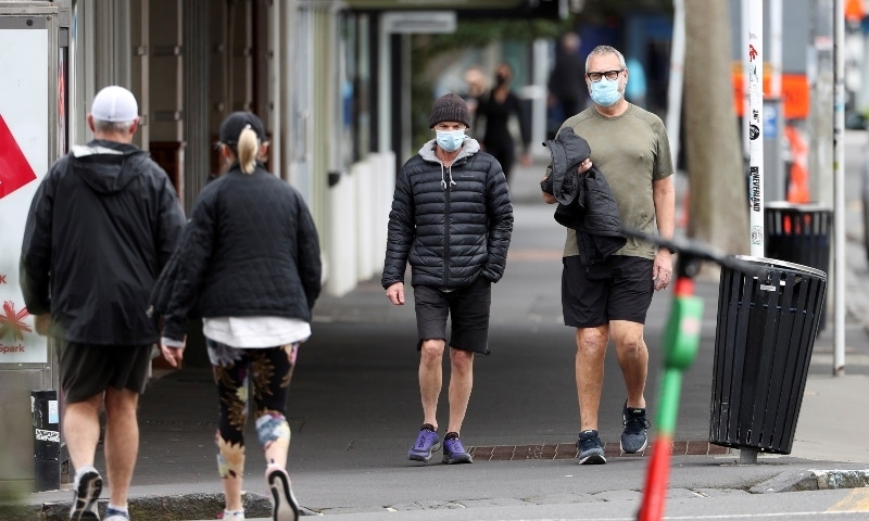 People wear masks as they exercise during a lockdown to curb the spread of a coronavirus disease outbreak in Auckland on August 26. — Reuters