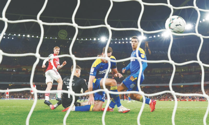 LONDON: Arsenal’s Emile Smith Rowe (L) scores during the League Cup third-round match against AFC Wimbledon at the Emirates Stadium.—Reuters LONDON: Arsenal’s Emile Smith Rowe (L) scores during the League Cup third-round match against AFC Wimbledon at the Emirates Stadium.—Reuters