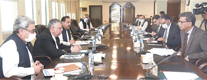 ISLAMABAD: Finance Minister Shaukat Tarin presides over the first meeting of the governing council of Pakistan Single Window on Friday.—APP