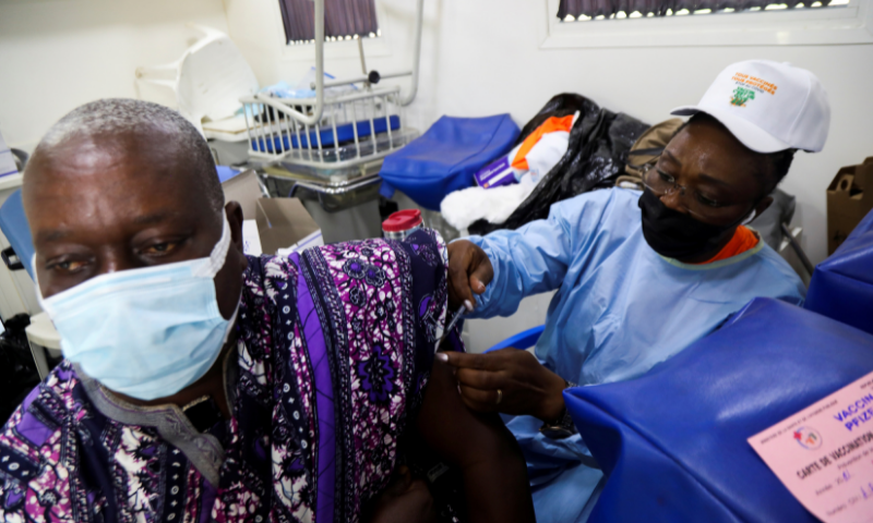 An Ivorian traditional chief receives a vaccine against the coronavirus in a vaccination truck in Abidjan, Ivory Coast. — Reuters