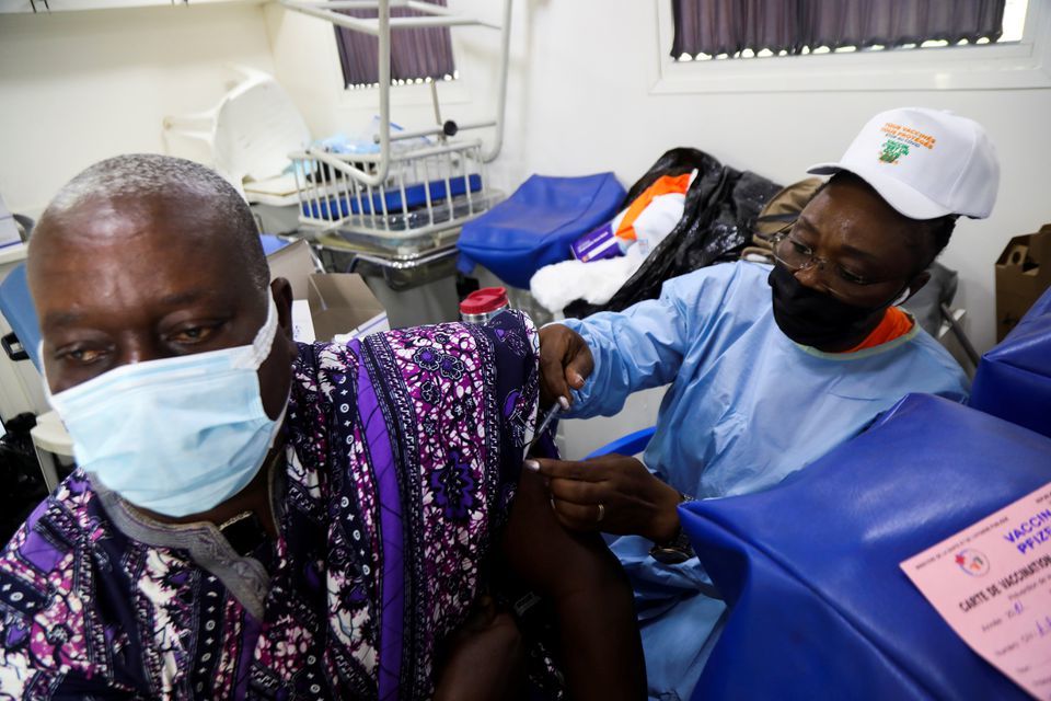 An Ivorian traditional chief receives a vaccine against the coronavirus in a vaccination truck at a mobile vaccination centre in Abidjan, Ivory Coast, September 23. &mdash; Reuters