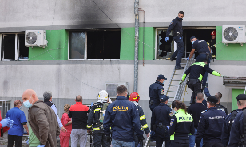 Emergency personnel assist the people evacuated after a fire broke out at the intensive care unit of a Covid-19 hospital in Constanta, Romania on Friday. &mdash; Reuters